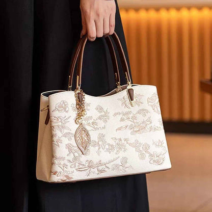 Sac à main brodé fleuri en cuir