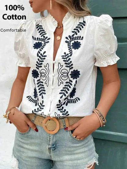 Blouse en coton à col cranté, broderies et volants, manches courtes