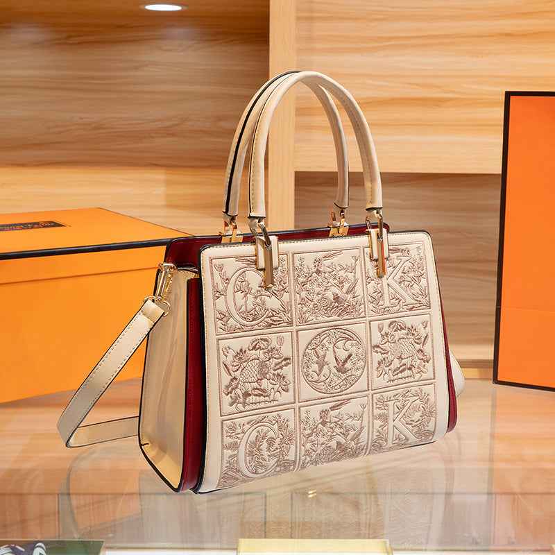 Sac à main brodé à poignée en cuir abricot