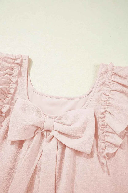 Mini-robe à volants et nœud dans le dos