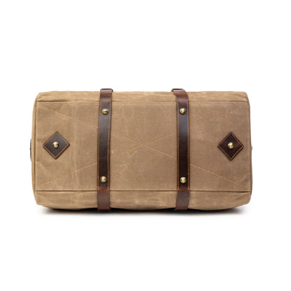 Sac de voyage Drakensberg modèle Cody, toile cirée et cuir de buffle tanndé végétal 50 L — bleu océan, kaki sable, vert forêt