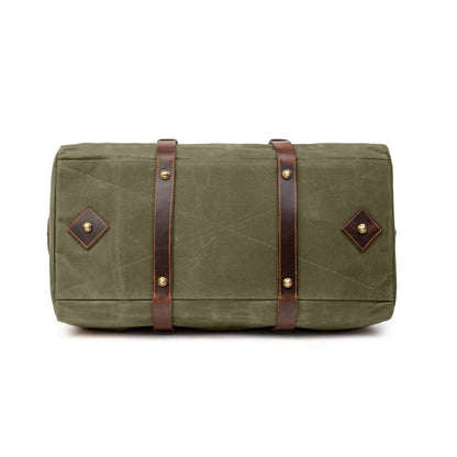 Sac de voyage Drakensberg modèle Cody, toile cirée et cuir de buffle tanndé végétal 50 L — bleu océan, kaki sable, vert forêt