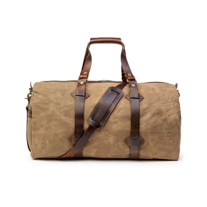 Sac de voyage Drakensberg modèle Cody, toile cirée et cuir de buffle tanndé végétal 50 L — bleu océan, kaki sable, vert forêt