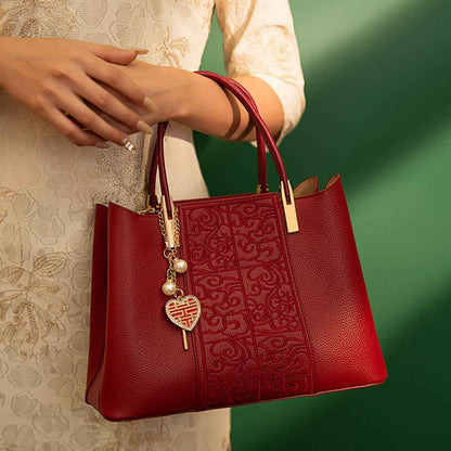 Sac à main gauffré à poignée en cuir rouge