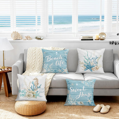 Lot de quatre housses de coussin en velours à motifs marins