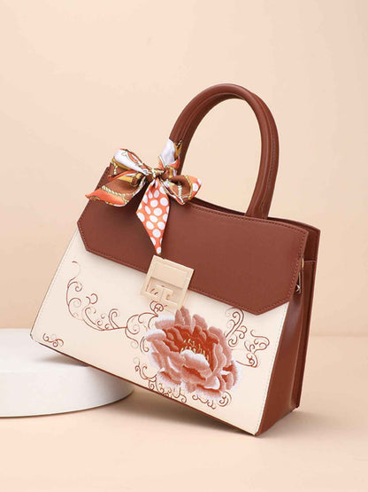 Sac à main en cuir de vachette à ornement floral