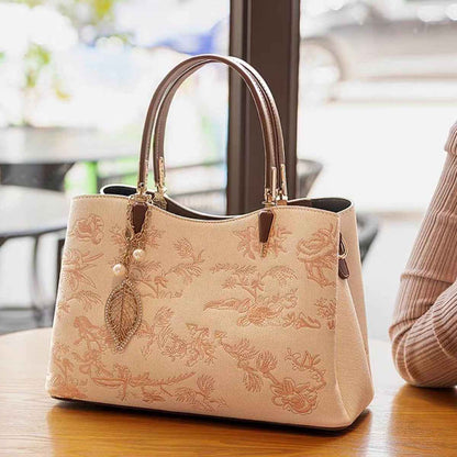 Sac à main brodé fleuri en cuir