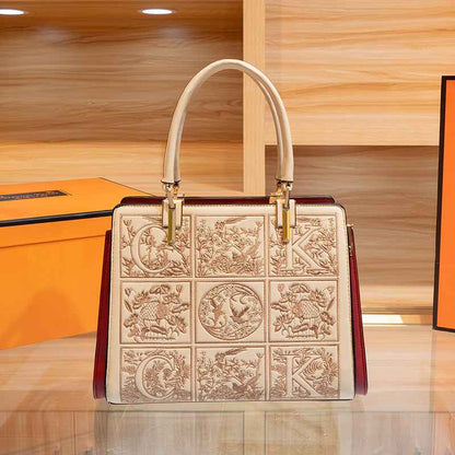 Sac à main brodé à poignée en cuir abricot