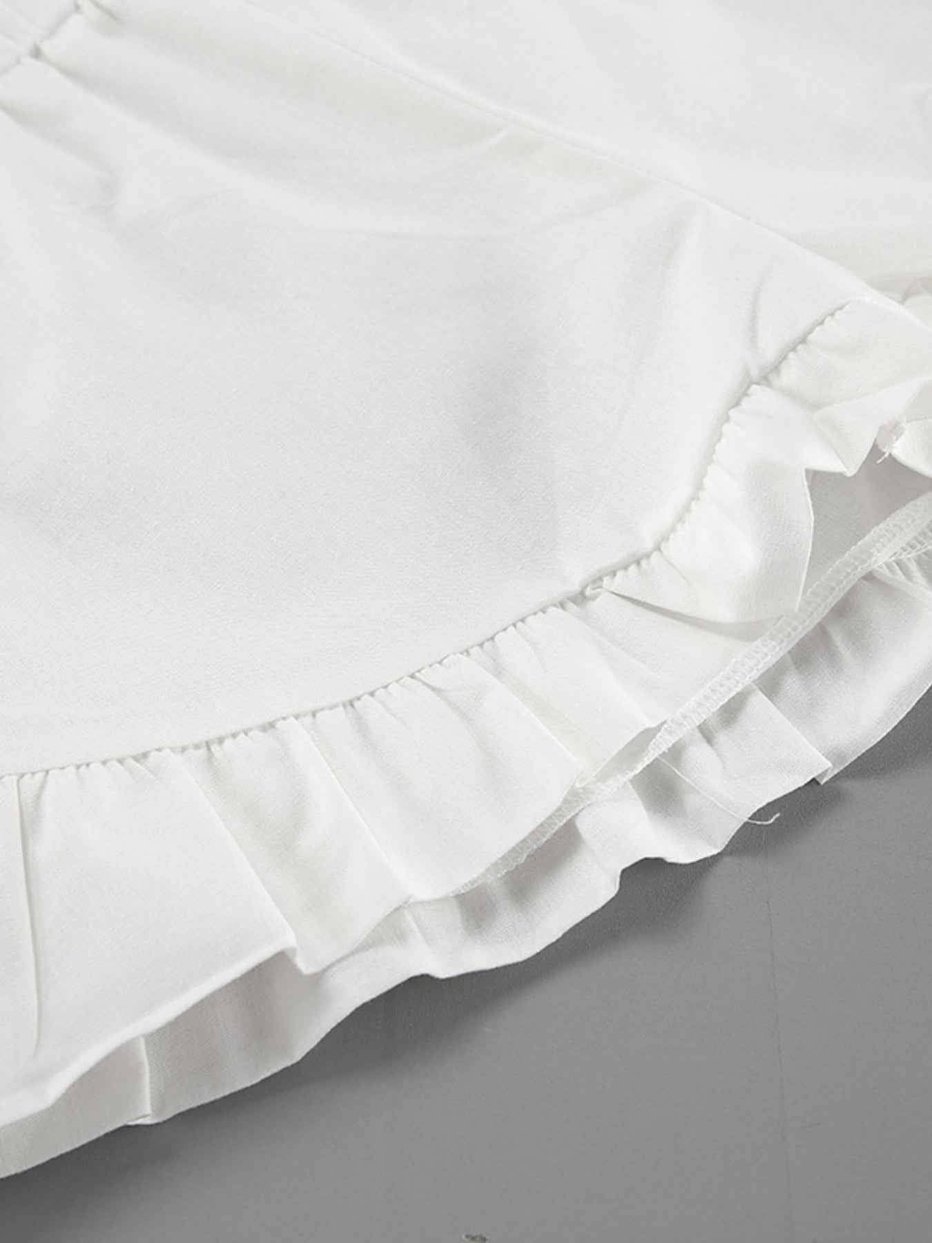 Ensemble deux pièces blouse à col noué et manches ballon avec short