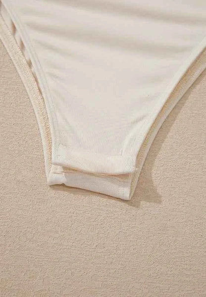 Body à manches longues col croisé et sequins