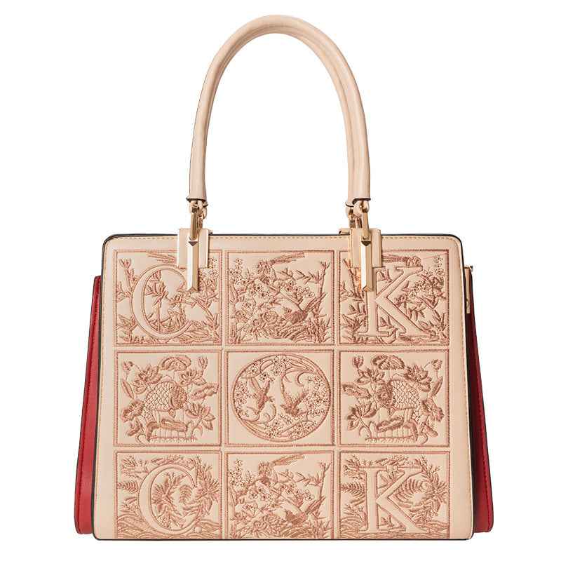 Sac à main brodé à poignée en cuir abricot