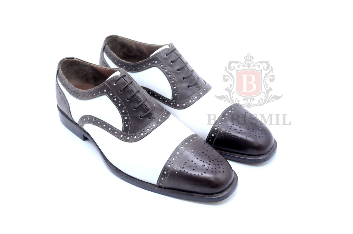 Oxford spectator bicolore brogues — construction Goodyear welt, cuir premium